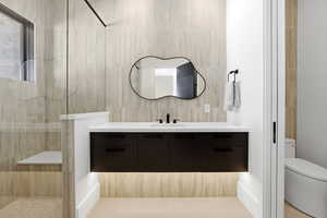 Heated Floors and ceiling-to-floor tile feature