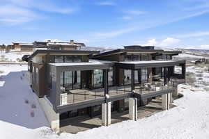 Back of Home. Floor to Ceiling Windows on both Levels