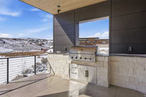 Open air BBQ area for views and smoke escape