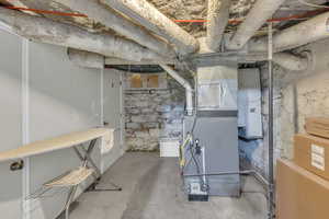 Unfinished below grade area with heating unit