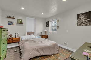 Bedroom featuring recessed lighting and wood finished floors