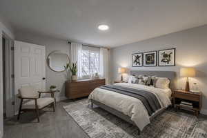 Bedroom with carpet and baseboards