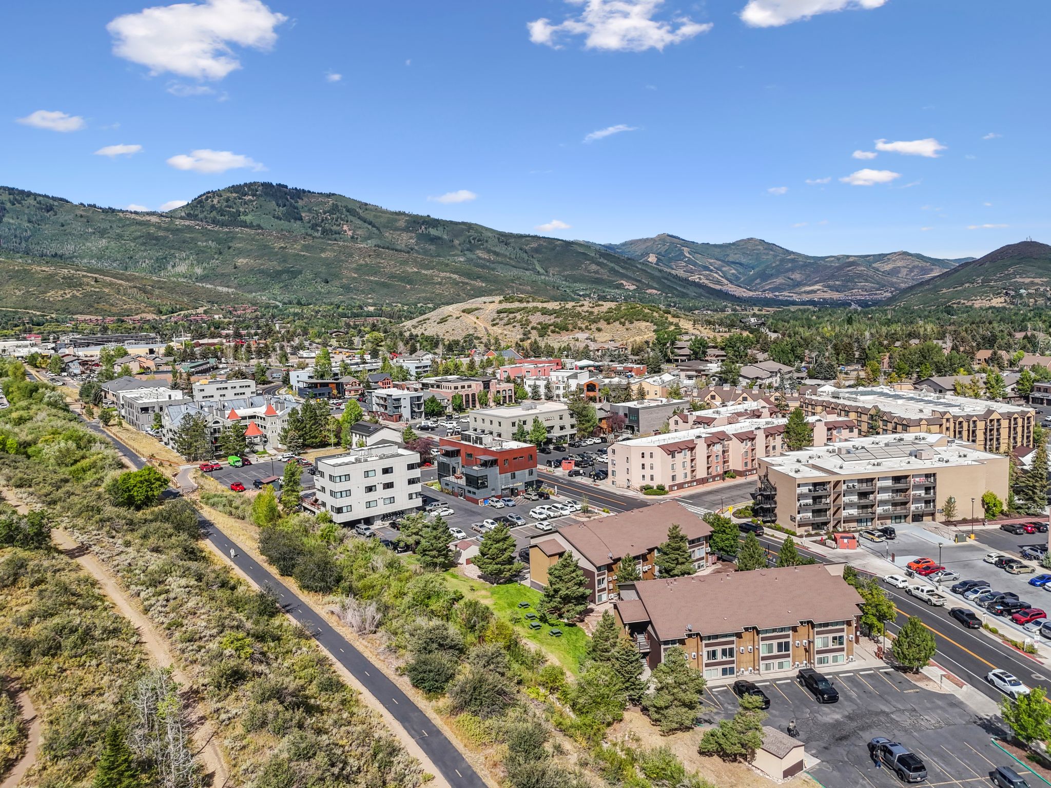 View of property location with a mountain backdrop and apartment complex / building