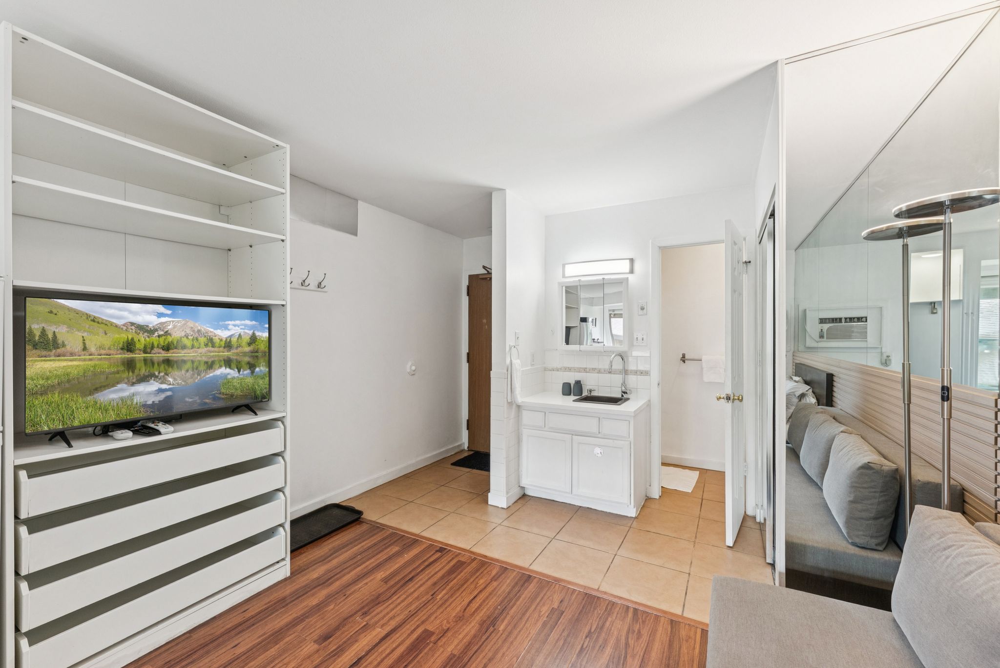 Bedroom featuring light wood-style floors and baseboards