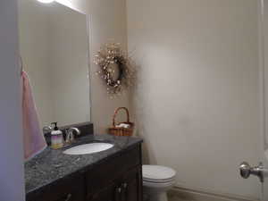 Bathroom featuring vanity and toilet