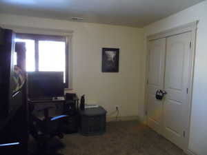 Carpeted bedroom with baseboards