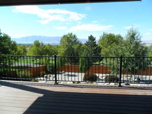 Main level deck featuring Trex decking and a mountain view