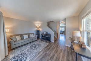 Living room featuring wood finished floors and baseboards