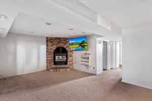 Carpeted living area with heating unit