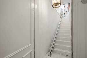 Stairs from the garage to the ADU with Chair Lift