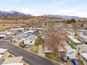 Aerial perspective of suburban area with a mountainous background
