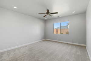 Empty room with light carpet, recessed lighting, and a ceiling fan