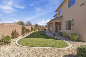 Fenced backyard featuring a patio