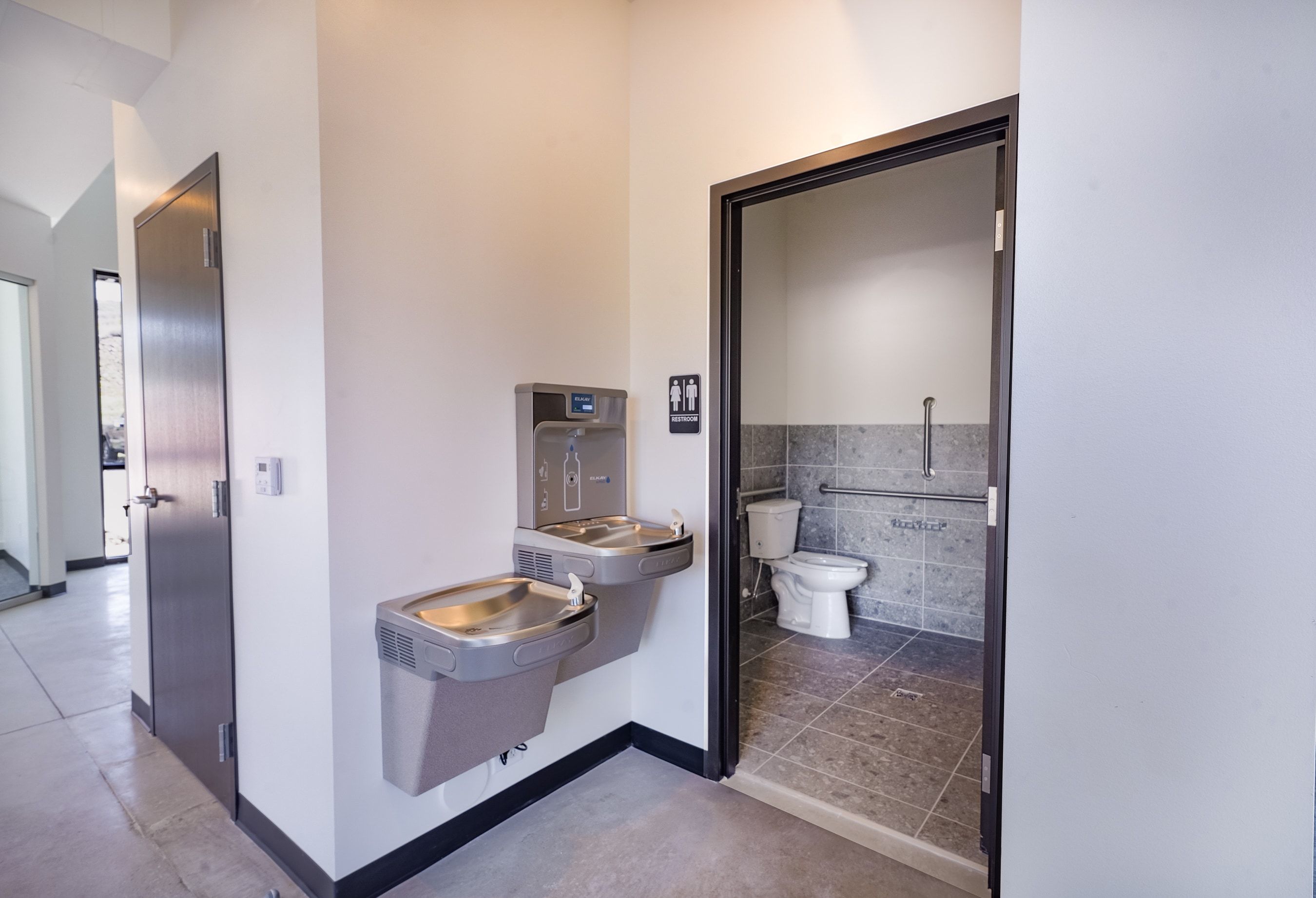Bathroom with toilet and baseboards