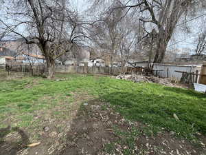 View of fenced backyard