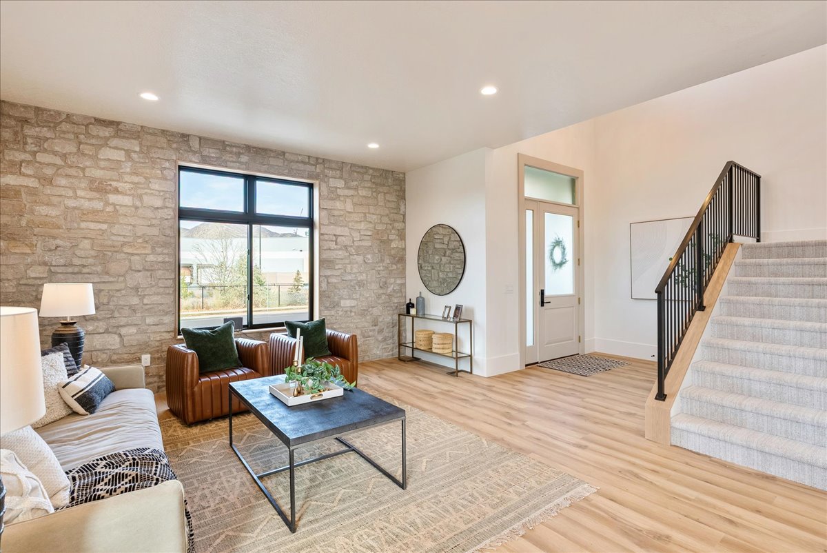 Living room featuring light wood-type flooring and recessed lighting