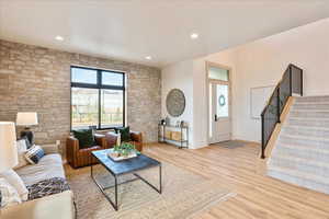 Living room featuring light wood-type flooring and recessed lighting