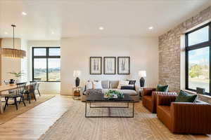 Living room featuring light wood-style flooring and recessed lighting