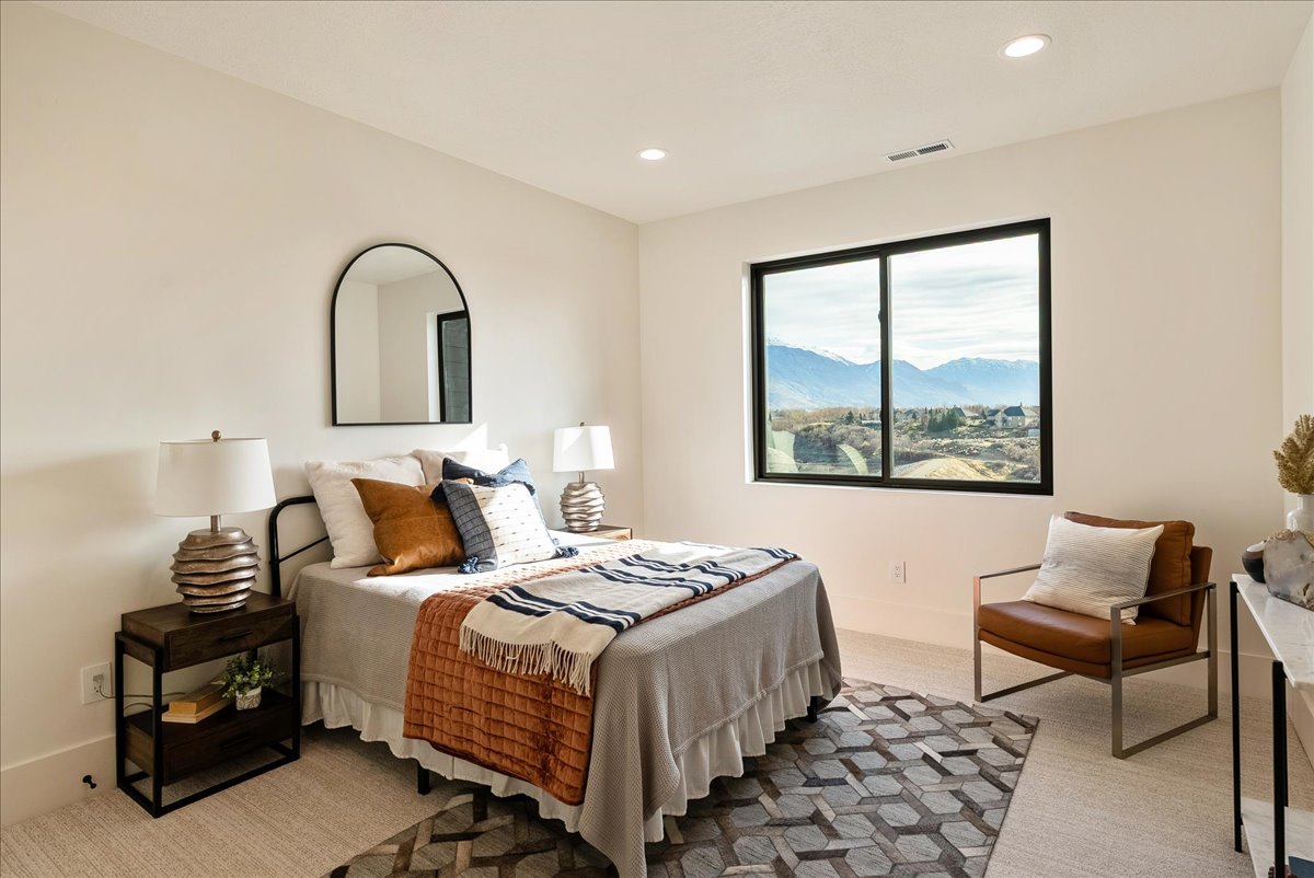 Bedroom featuring a mountain view and recessed lighting