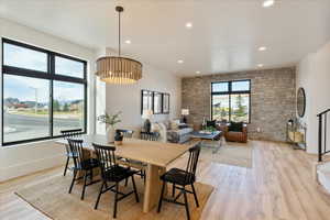 Dining room featuring light wood-type flooring and recessed lighting