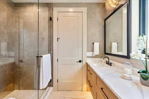 Full bathroom featuring a shower stall and vanity