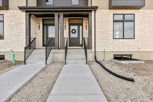 Property entrance with stone siding