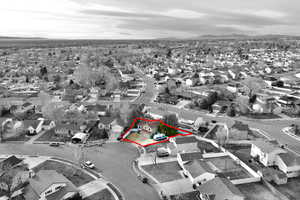 Aerial view of residential area featuring property boundaries highlighted