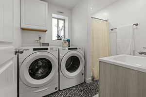 Laundry area featuring independent washer and dryer