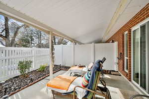 Fenced backyard with a patio area