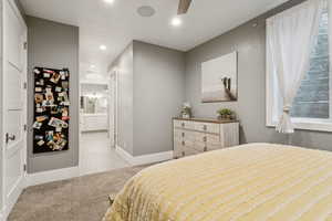 Bedroom with recessed lighting, light carpet, and a ceiling fan