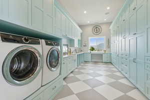Laundry area with washer and clothes dryer, light flooring, cabinet space, and recessed lighting
