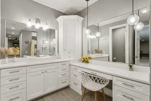 Bathroom featuring vanity, recessed lighting, and light wood finished floors