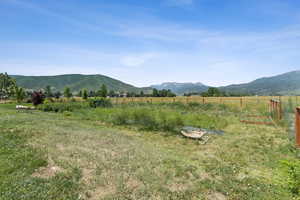 View of mountain background featuring rural landscape