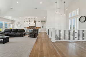 Living room featuring light wood finished floors and recessed lighting