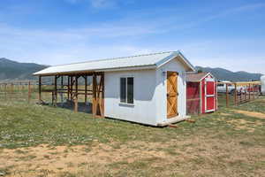 View of shed with a mountain view and exterior structure