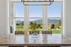 Dining room featuring a mountain view and plenty of natural light