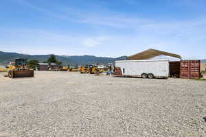 View of outdoor structure featuring a mountain view and a carport