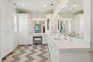 Primary Bathroom with vanity, recessed lighting, and light flooring