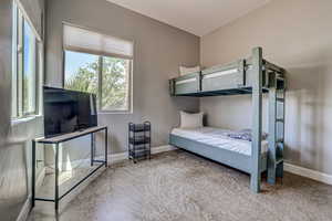 Carpeted bedroom with baseboards