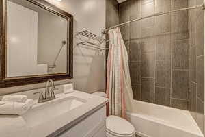 Full bathroom featuring vanity and shower / bath combo with shower curtain