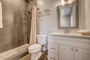 Bathroom featuring vanity and a stall shower