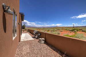 Fenced yard with a patio and a mountain view