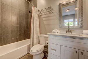 Bathroom featuring vanity and shower / tub combo