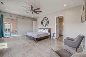 Bedroom with access to exterior, recessed lighting, a ceiling fan, connected bathroom, and concrete floors