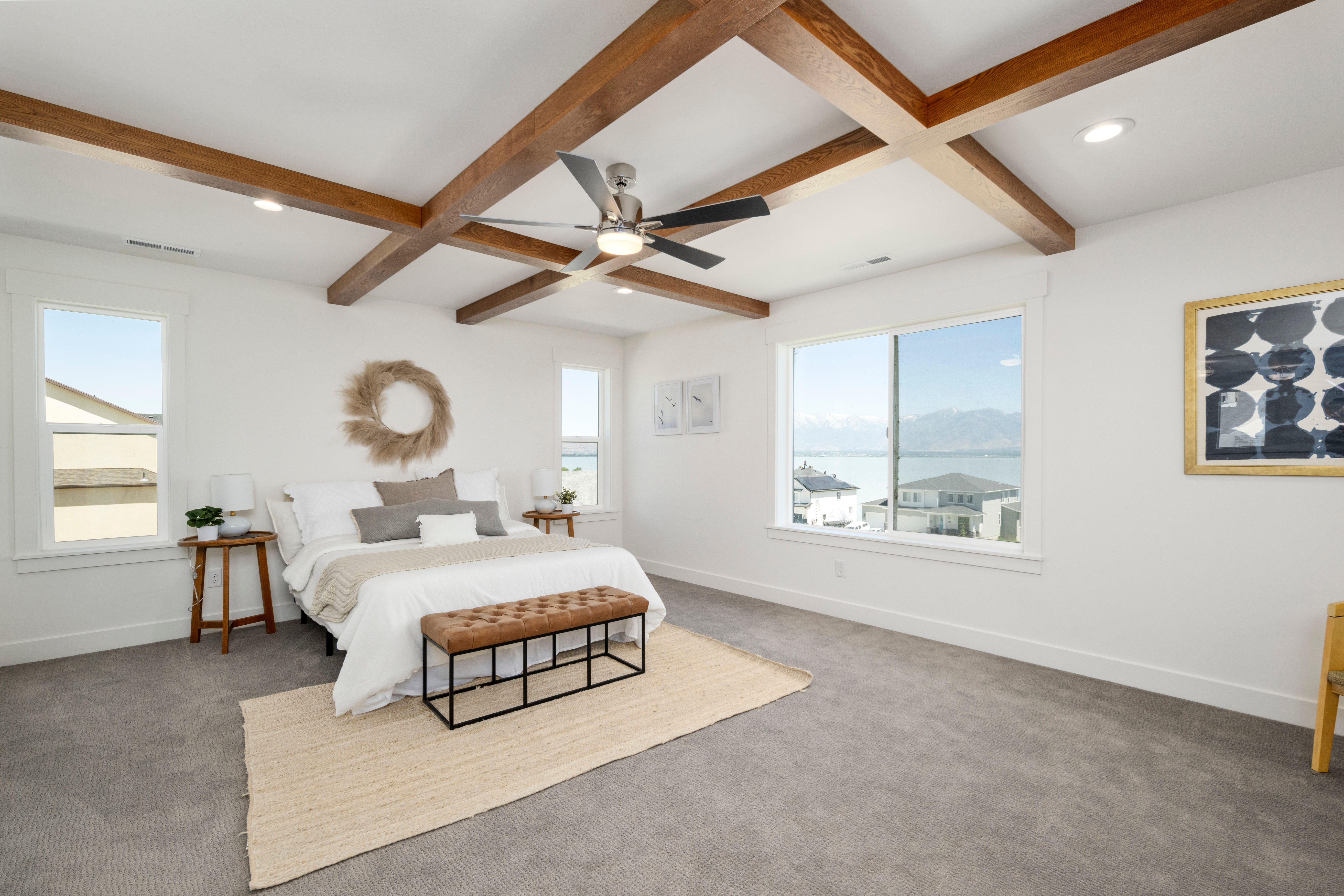 Bedroom featuring carpet floors, coffered ceiling, ceiling fan, recessed lighting, and a water view