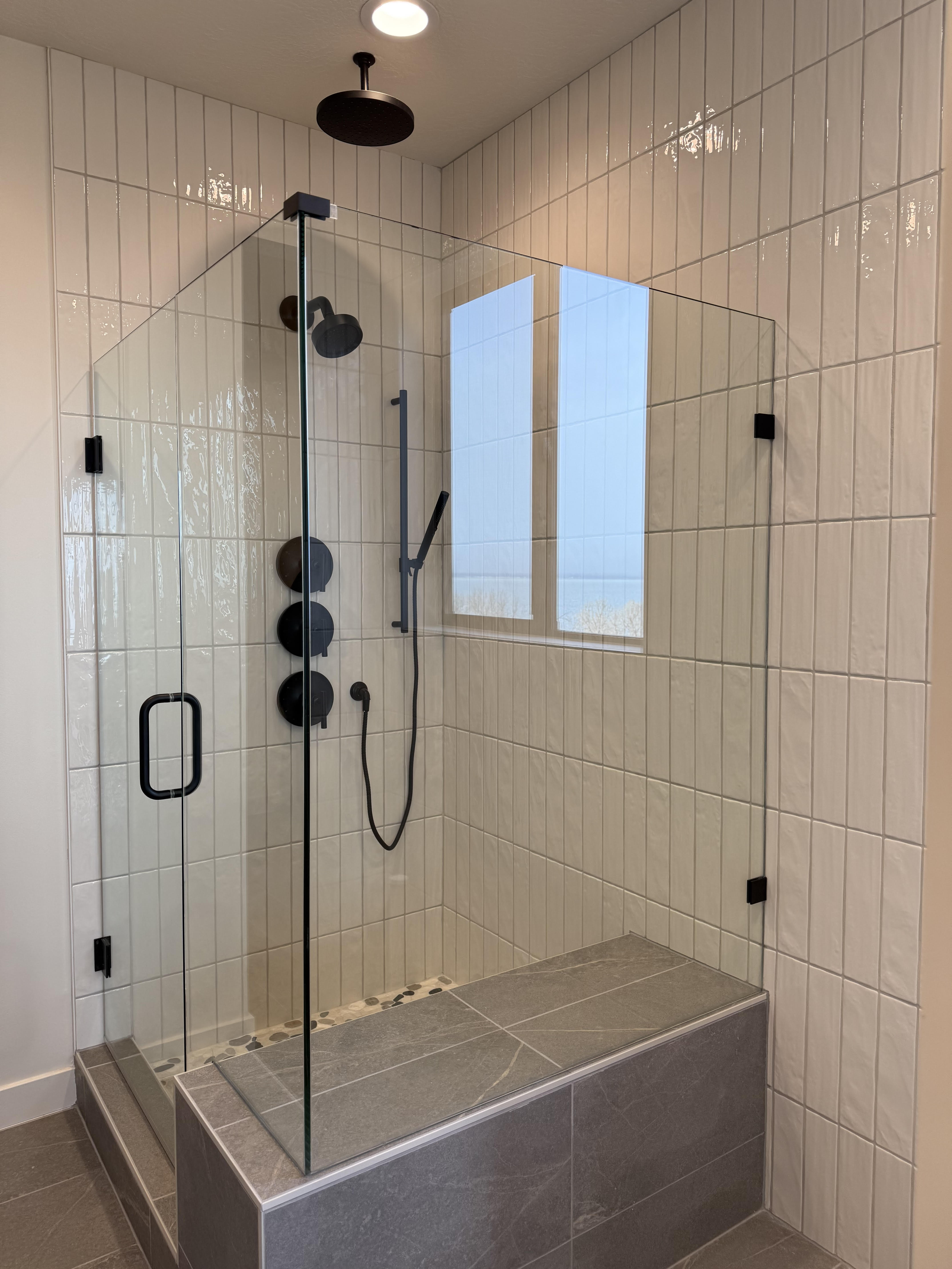 Full bathroom with a shower stall