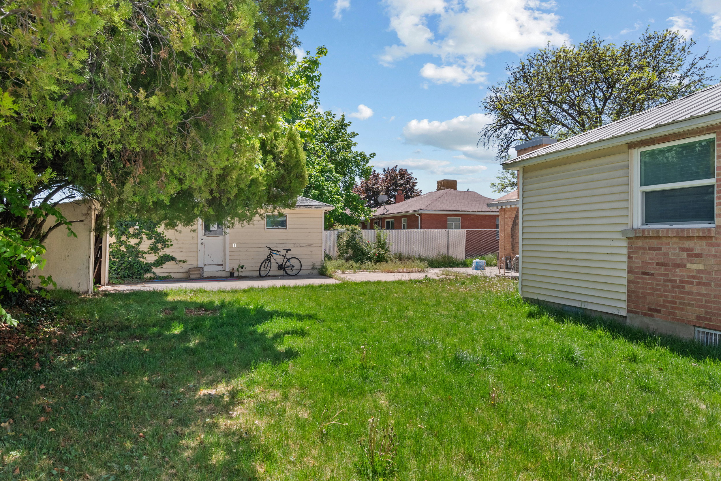 Expansive green lawn with established trees