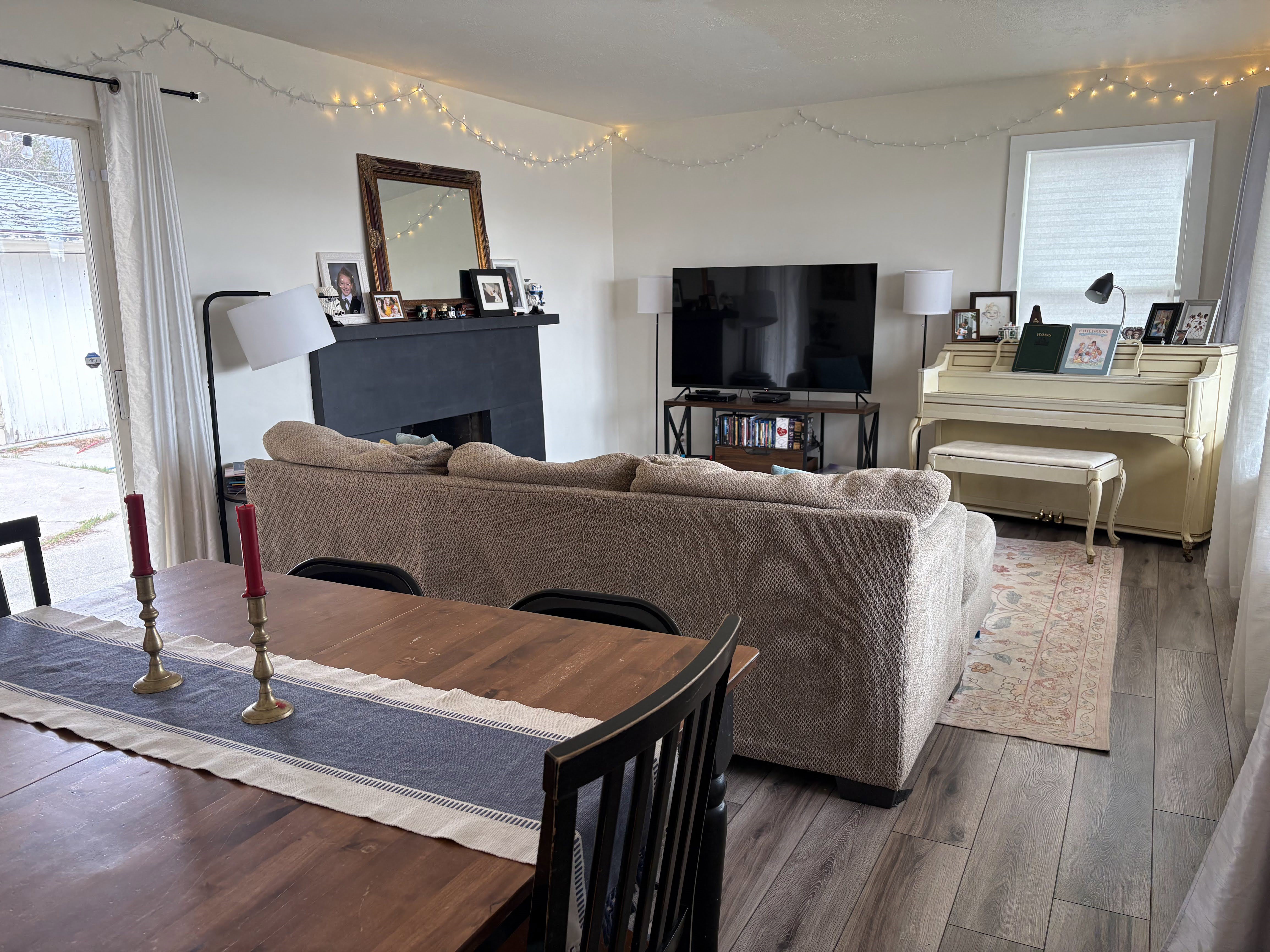 Living room featuring wood-type flooring and a fireplace