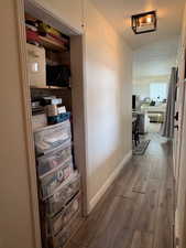 Hall featuring dark wood-style floors and a textured ceiling
