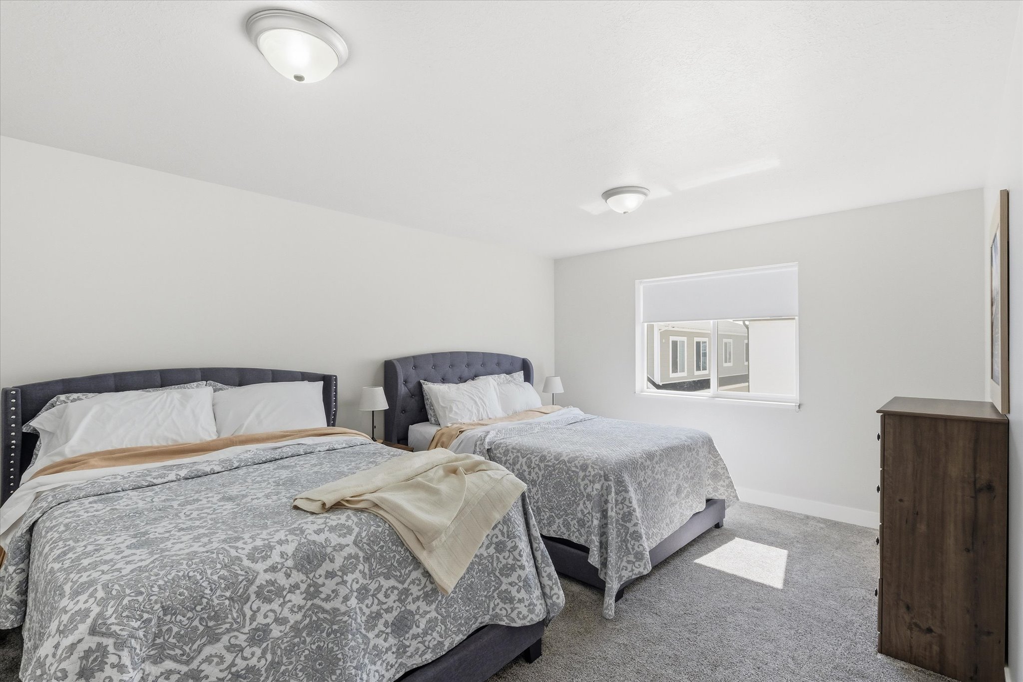 Carpeted bedroom with baseboards